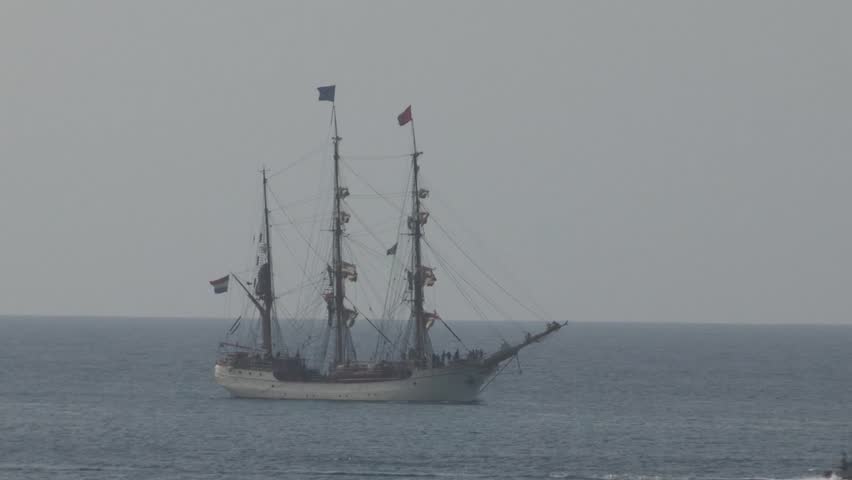A medium shot of one of the three old Dutch sailing ships at sea entering the