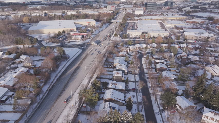 Aerial winter view of Derry Rd in Mississauga with highway 401 visible