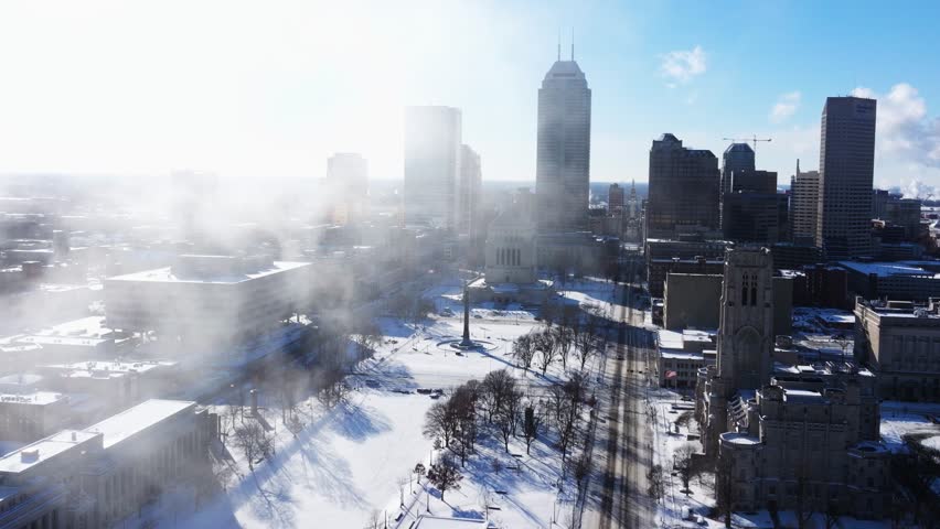 Downtown Indianapolis Skyline - Drone Flying through Fog on Winter Day with Snow