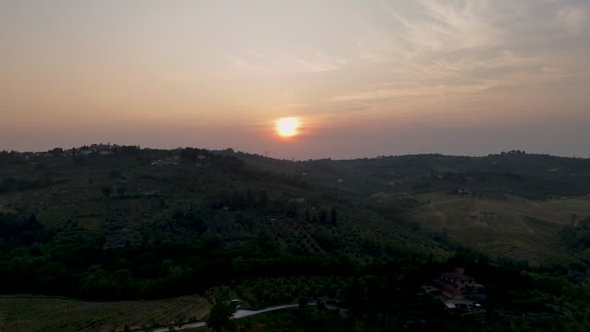Aerial sunset views of rolling Tuscan hills near Impruneta, Florence, Italy, showcasing warm light, gentle landscapes, and classic countryside scenery.