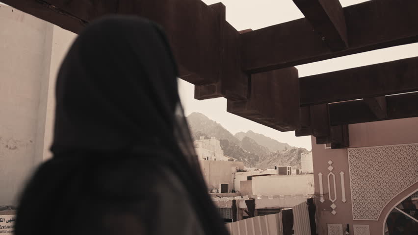 Woman Standing at Elevated View Overlooking Mutrah Souq, Muscat, Oman
Cinematic shot of a woman standing at an elevated viewpoint overlooking Mutrah Souq in Muscat, Oman. The scene conveys travel inspiration, cultural atmosphere, and a sense of discovery within a traditional market setting. Ideal for tourism promotion, lifestyle visuals, storytelling, and cinematic background scenes.

Mutrah Souq, Muscat, Oman
December 2024
