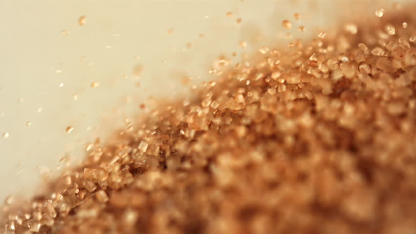 Cane sugar falls into a heap. Filmed on a high-speed camera at 1000 fps. High quality FullHD footage