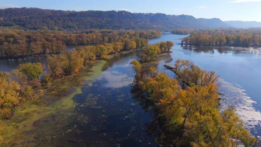 Peaceful autumn scene of forested river islands in a sunlit wetland ecosystem. Wisconsin