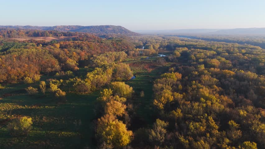 Winding river surrounded by woodland forest in the drift less area, Wisconsin