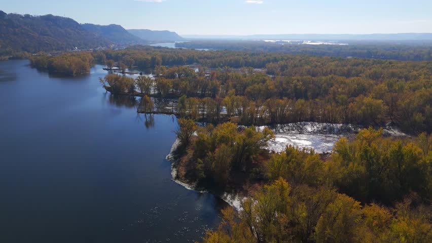 Forested island rises from wetlands in the Driftless Area ecosystem.
