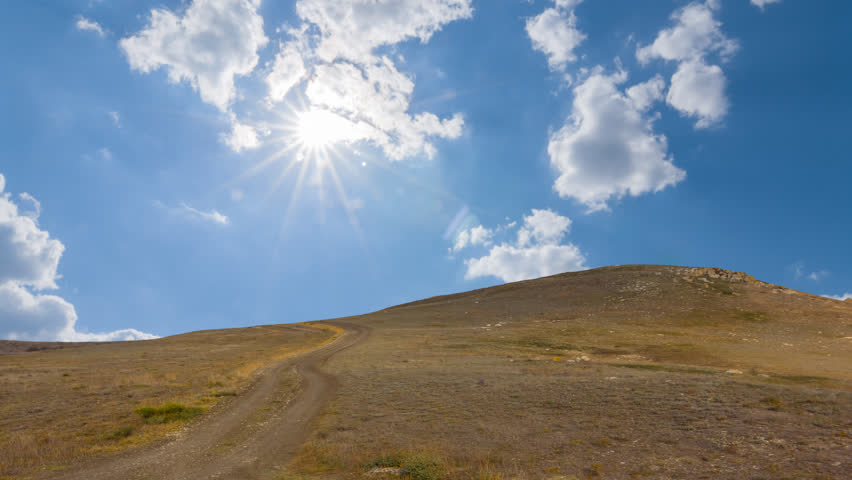 prairie hill under sparkle sun natural time lapse scene