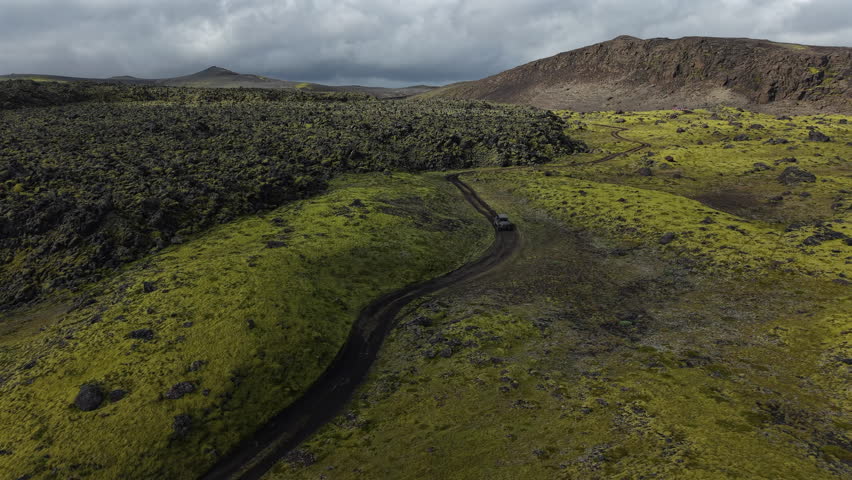 ATV Driving through Moss Covered Lava Fields Iceland Aerial View