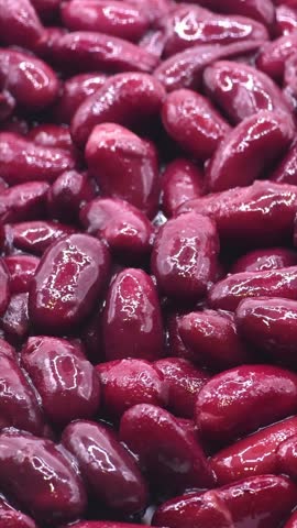 Organic healthy red beans seeds close-up. Vegetarian food or salad ingredient, vertical video