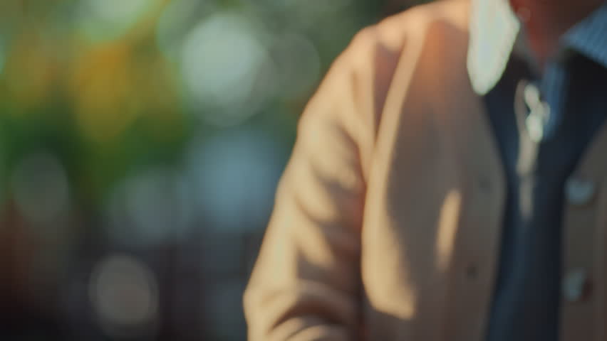 Close up of human hands carefully holding a small globe with a miniature green tree growing on top for environmental protection, sustainability, and Earth Day concept