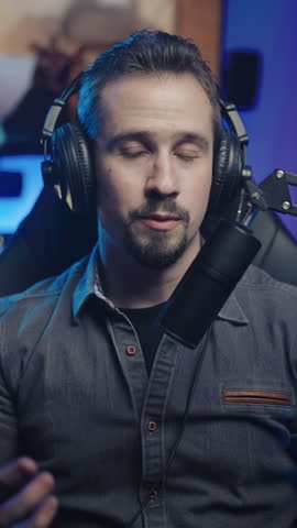 Gamer influencer streaming live talking to fans with game playing in background