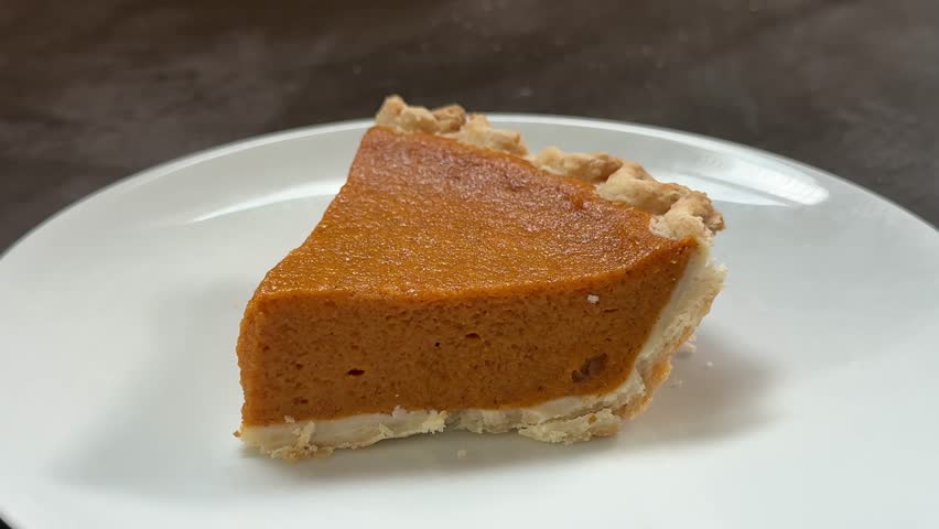 Closeup of Eating a Slice of Delicious Pumpkin Pie