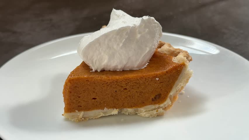 Closeup of Eating a Slice of Delicious Pumpkin Pie