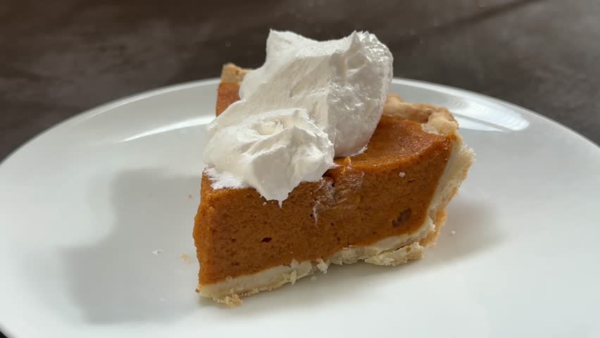 Closeup of Eating a Slice of Delicious Pumpkin Pie