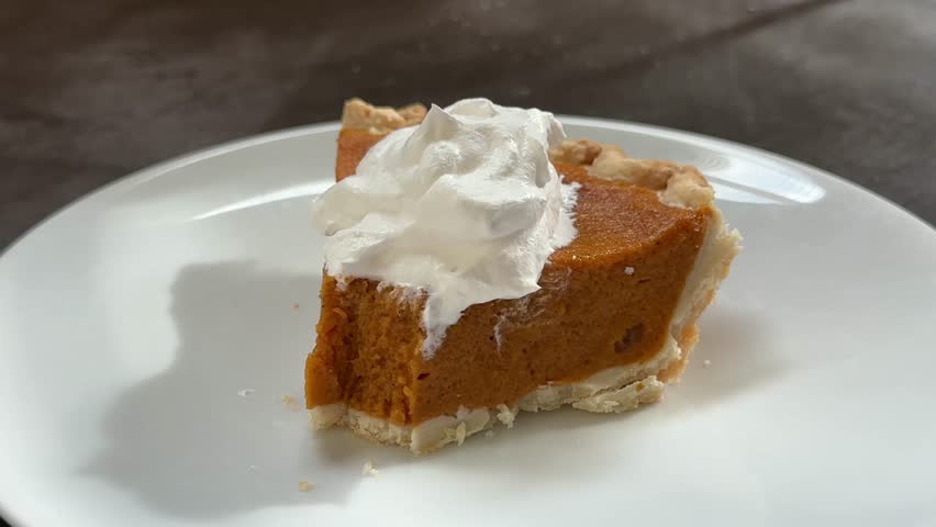 Closeup of Eating a Slice of Delicious Pumpkin Pie