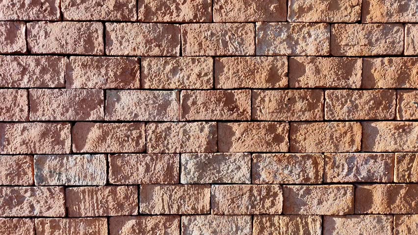 Rough Brown Red Brick Wall Background Texture Pattern close-up Surface Detail with sunlight and shadow for Architecture Material Old Urban Building Wallpaper Backdrop