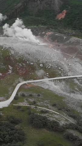 Vertical Aerial fly Mount Kirishima Volcano, White Smoke Venting from Crater, Japan