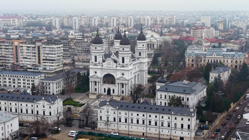 Aerial view of Iași Metropolitan Cathedral and City Hall building in central cityscape, Romania