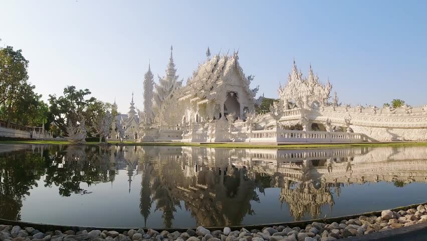 Chiang Rai, Thailand - March 15th ,2024: zoom out Wat Rong Khun or White Temple - famous Buddhist temple in Pa O Don Chai, Mueang District, Chiang Rai Province, Thailand