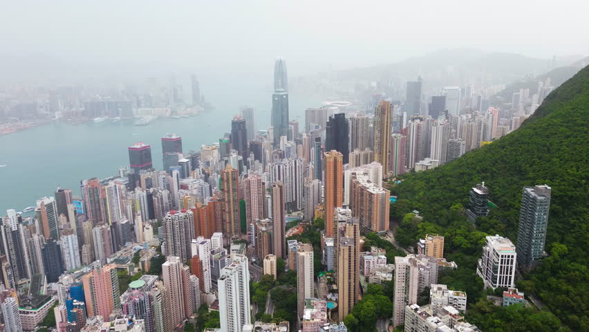 Aerial overview of skyscrapers in the Central Business district of foggy Hong Kong