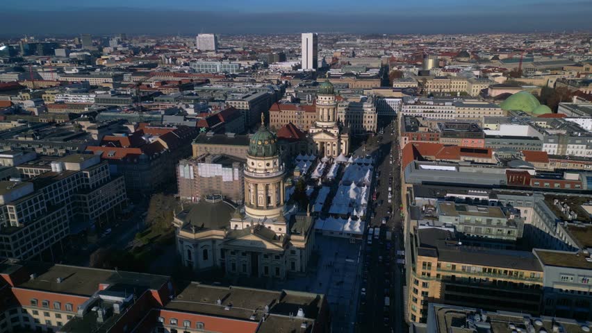 Berlin Gendarmenmarkt aerial view with Christmas market and cityscape. Nice aerial view panorama orbit drone