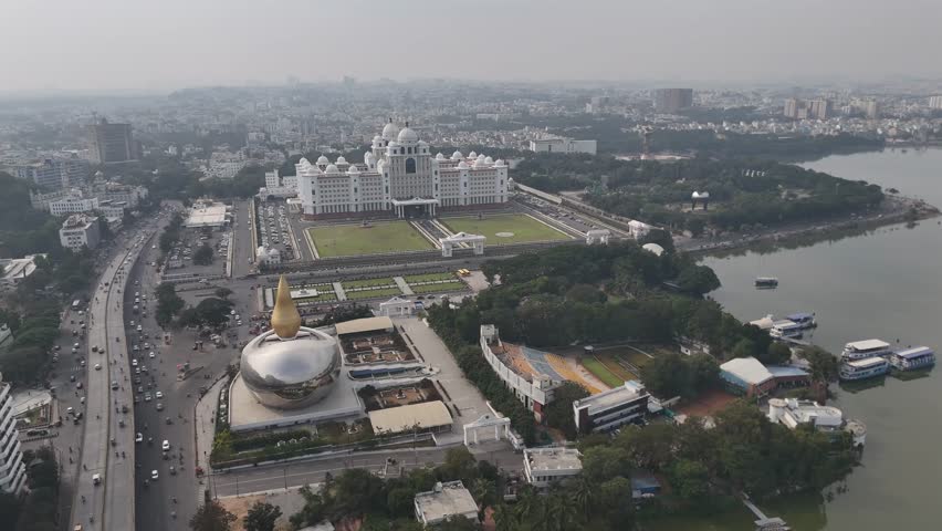 High-altitude aerial footage capturing Hyderabad’s expansive cityscape under daylight conditions.