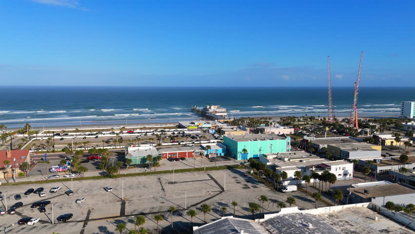 Drone aerial view of Daytona Beach Florida coastline with pier