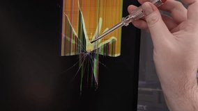 An electronics technician examines a cracked LCD matrix with a screwdriver, the shattered screen showing colorful glitch lines, concept of digital breakdown. Zoom - Powered by Shutterstock - Get 15% off with code: PIKWIZARD15