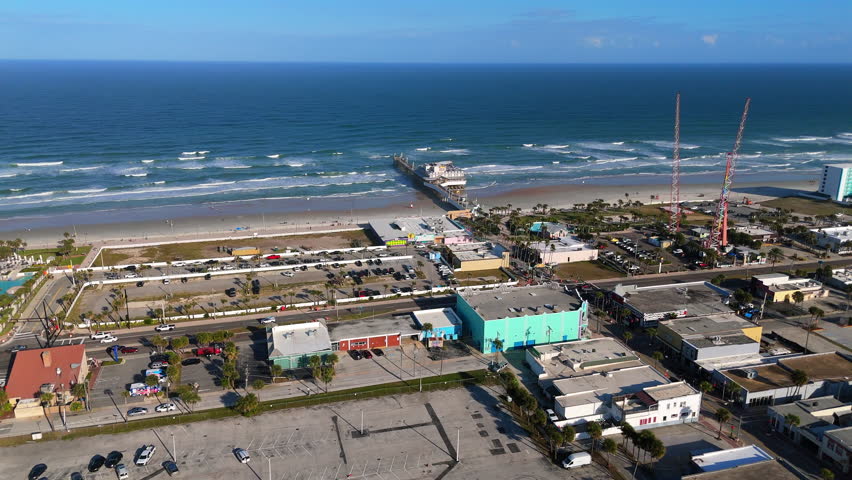 Drone aerial view of Daytona Beach Florida ocean pier and shoreline