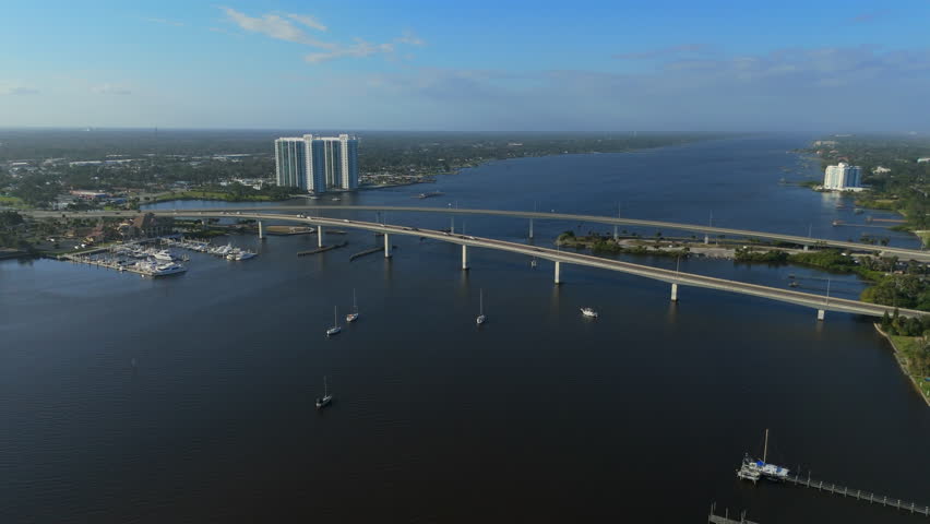 Aerial drone view of long bridge over wide river near Daytona Beach