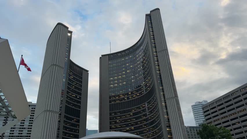 Street Level Footage Of Toronto Downtown Ontario Canada Showing Active City Life With Vehicles Passing By And People Walking Among Tall Business Buildings On A Sunny Day