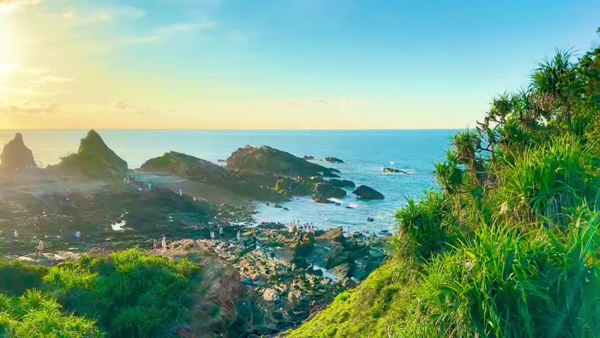 Close-up of thousand-year-old sedimentary rock layers under the sunrise of Co To Island. Each rock vein and geological structure appears clearly under the soft morning light. Captured in Mong Rong stone beach, Co To Island, Quang Ninh, Vietnam on July 20, 2025. A wonderful document of geology and the pristine beauty of Northeast Vietnam