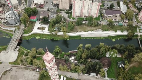 Sideways Drone Flight along River Embankment
