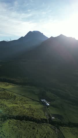 Vertical shot of a flyover over the Colombian moorland with views towards the Nevado de Tolima volcano near canyons and rock formations