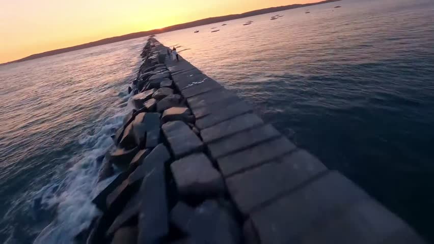 FPV Drone Aerial of Eastern Point Lighthouse at Sunset