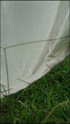 An elegant 4K vertical video featuring soft fabric waving gently in a slow breeze, creating a soothing and minimalist background perfect for luxury brand social media stories, meditation app interfaces, and high end fashion promotion