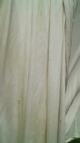 An elegant 4K vertical video featuring soft fabric waving gently in a slow breeze, creating a soothing and minimalist background perfect for luxury brand social media stories, meditation app interfaces, and high-end fashion promotion