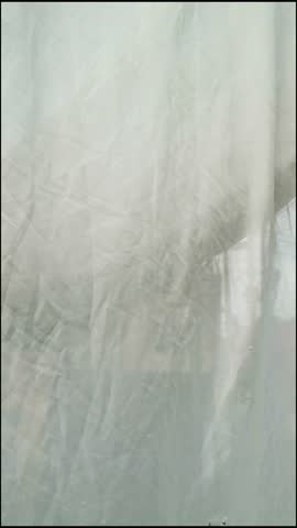 An elegant 4K vertical video featuring soft fabric waving gently in a slow breeze, creating a soothing and minimalist background perfect for luxury brand social media stories, meditation app interfaces, and high end fashion promotion