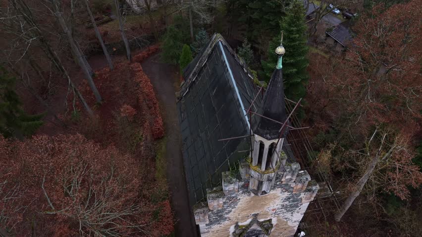 Medieval Catholic Church in Cold Landscape
