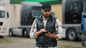 Truck driver managing fleet logistics using tablet - Powered by Shutterstock - Get 15% off with code: PIKWIZARD15