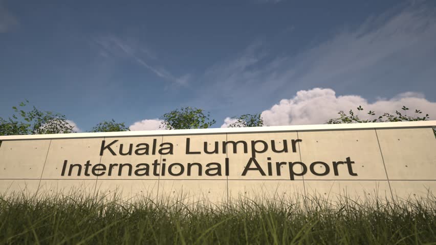 Arrivals at Kuala Lumpur International Airport with airplane landing near terminal, Kuala Lumpur, Malaysia
