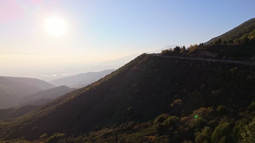 Aerial push in shot of Panorama Point along the Rim of the World Scenic Byway with colorful autumn foliage and majestic mountains in the San Bernardino National Forest