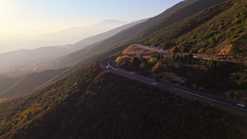 Aerial orbit of Panorama Point along the Rim of the World Scenic Byway with colorful autumn foliage and majestic mountains in the San Bernardino National Forest