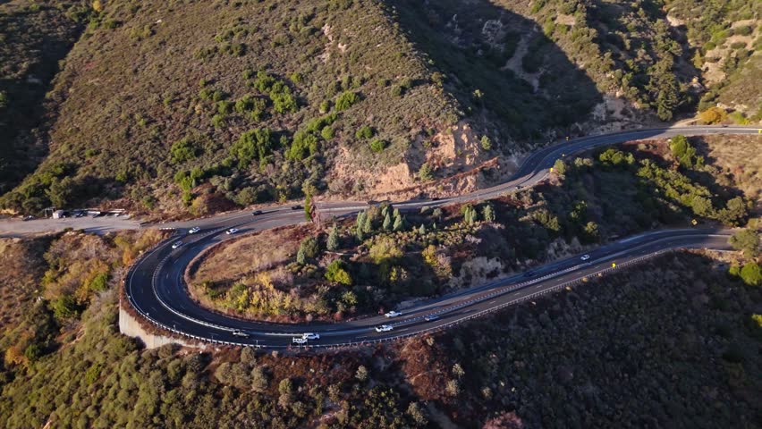 High aerial orbit of Panorama Point along the Rim of the World Scenic Byway with colorful autumn foliage and majestic mountains in the San Bernardino National Forest