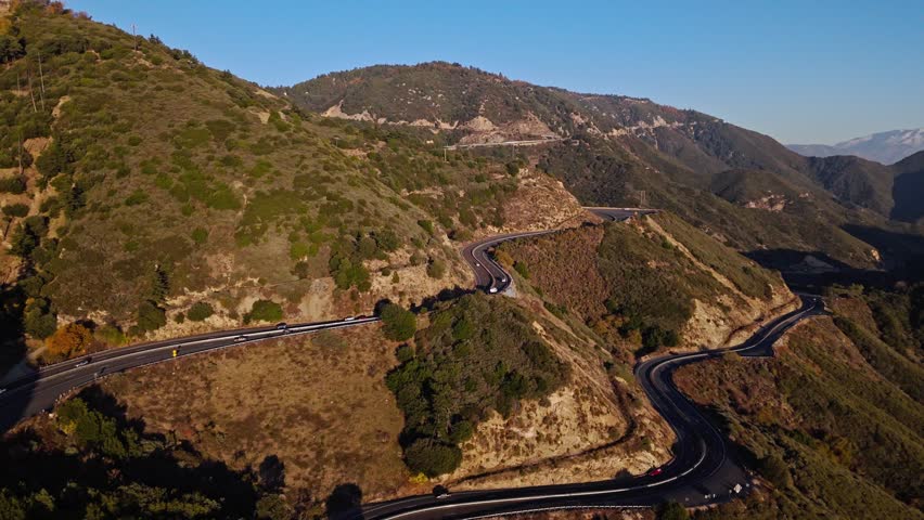 Aerial flyover of Panorama Point along the Rim of the World Scenic Byway with colorful autumn foliage and majestic mountains in the San Bernardino National Forest