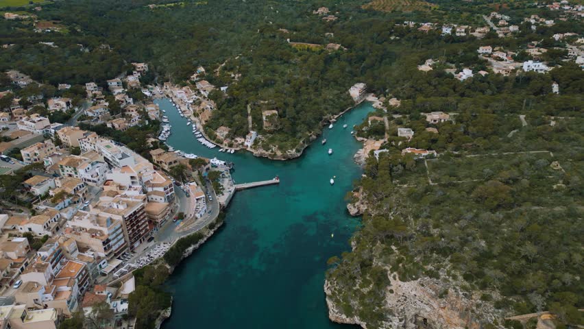 Seaside marina with blue turquoise clear sea water, sailing ships boats and hotels, Palma de Mallorca Island 4k