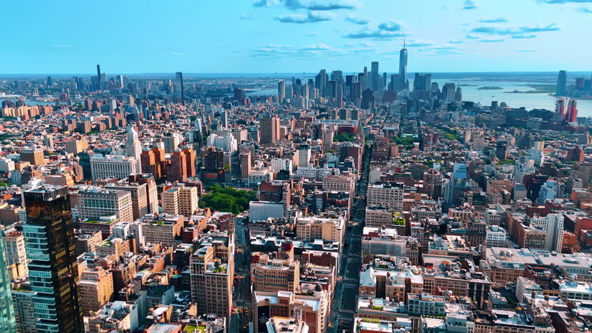 Enormous cityscape of New York, USA. Drone descends above the Fifth Avenue leading to the stunning Manhattan.