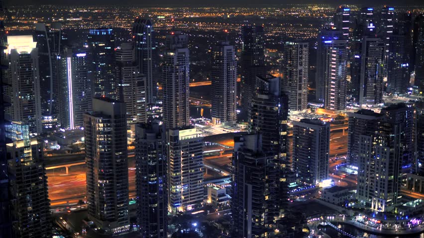 "Aerial cityscape of Dubai skyline and urban roads in the UAE, showcasing modern architecture, skyscrapers, traffic, and vibrant city life."