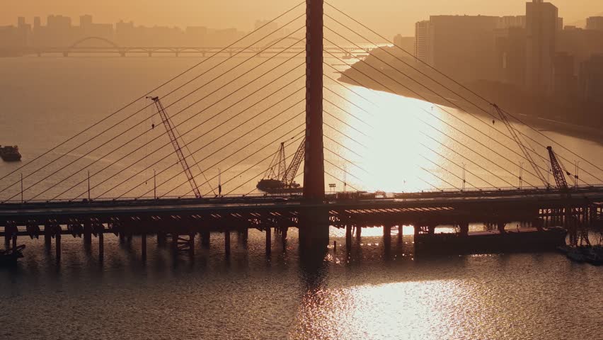 River bridge construction at sunset in Hangzhou, China from high angle view