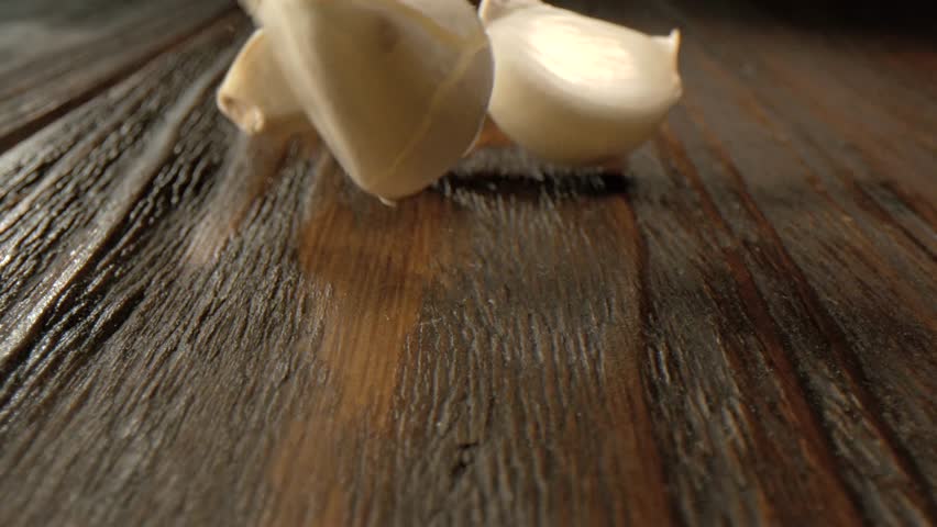 Super Slow Motion Chef And Stylist Prepare Ingredients, Macro Shot Capturing Garlic Textures And Warm Kitchen