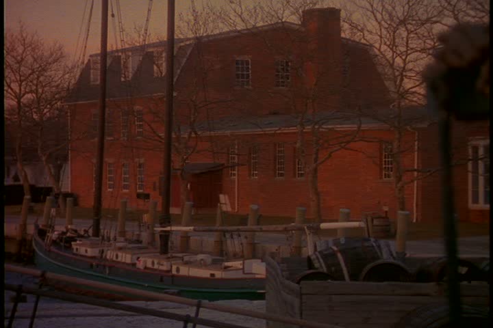 Exterior shots of seaport village in early morning light in Connecticut; WS red brick port building in golden sunlight.